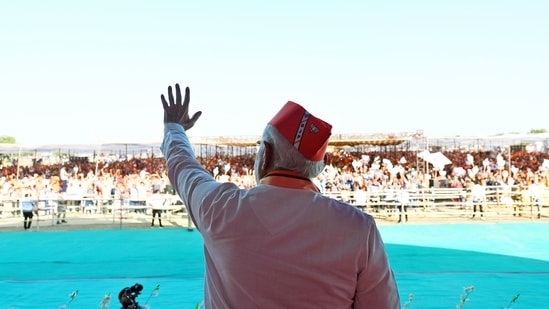 Gujarat Assembly election 2022: Prime Minister Narendra Modi waves to the people during a public meeting in Kutch (Twitter/BJP Gujarat via ANI)