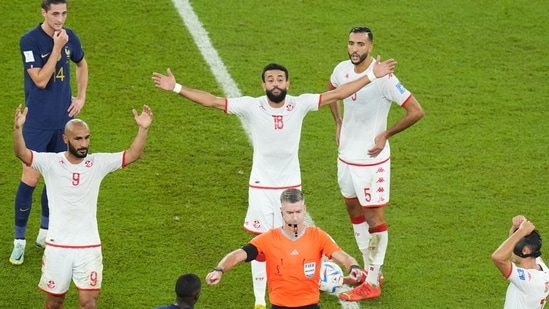 Tunisia's players reacts as Referee Matthew Conger, of New Zealand, signals the use of VAR during the World Cup group D match(AP)