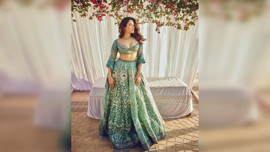 Tamannaah Bhatia's set comes with an embellished lehenga, a tussle blouse featuring a plunging neckline and a sheer dupatta.(Instagram/@tamannaahspeaks)