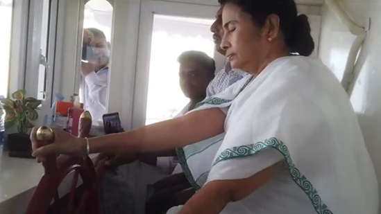 West Bengal CM Mamata Banerjee drives a boat. (Screengrab/TMC Twitter video)