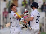 England's Ollie Pope, left, celebrates with teammate Harry Brook after scoring century during the first day(AP) England's Ollie Pope, left, celebrates with teammate Harry Brook after scoring century during the first day(AP)