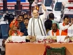 Union Home Minister Amit Shah during his election campaign roadshow ahead of the Assembly elections, in Ahmedabad, Wednesday, Nov 30, 2022. (PTI) Union Home Minister Amit Shah during his election campaign roadshow ahead of the Assembly elections, in Ahmedabad, Wednesday, Nov 30, 2022. (PTI)