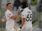 England's Harry Brook, left, is congratulated by teammate Ben Stokes after scoring century during the first day of the first test cricket match between Pakistan and England, in Rawalpindi, Pakistan, Dec. 1, 2022. (AP Photo/Anjum Naveed) England's Harry Brook, left, is congratulated by teammate Ben Stokes after scoring century during the first day of the first test cricket match between Pakistan and England, in Rawalpindi, Pakistan, Dec. 1, 2022. (AP Photo/Anjum Naveed)