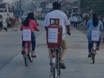 Gujarat assembly election: Congress MLA Paresh Dhanani commutes to the polling booth on a bicycle with a gas cylinder mounted atop.