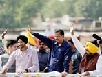 Chief Minister of Delhi and AAP national convenor Arvind Kejriwal along with Punjab Chief Minister Bhagwant Mann and party leader Harbhajan Singh waves to supporters during a road show for the second phase of Gujarat Assembly Elections, in Ahmedabad on Thursday. (ANI Photo) Chief Minister of Delhi and AAP national convenor Arvind Kejriwal along with Punjab Chief Minister Bhagwant Mann and party leader Harbhajan Singh waves to supporters during a road show for the second phase of Gujarat Assembly Elections, in Ahmedabad on Thursday. (ANI Photo)