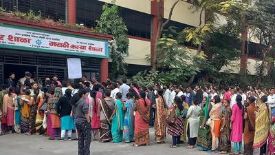 People waiting to vote outside a polling station in Surat. (AFP)