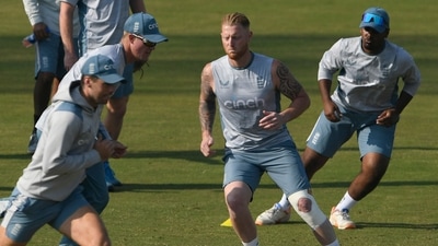 England's captain Ben Stokes (2R) warms up along with teammates during a training session ahead of their first cricket Test match against Pakistan, at the Rawalpindi Cricket Stadium in Rawalpindi on November 28, 2022. (Photo by Aamir QURESHI / AFP) (AFP)