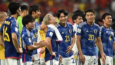 Japan's Shuto Machino, Ayase Ueda and Takuma Asano celebrate after the match as they qualify for the knockout stages (REUTERS)