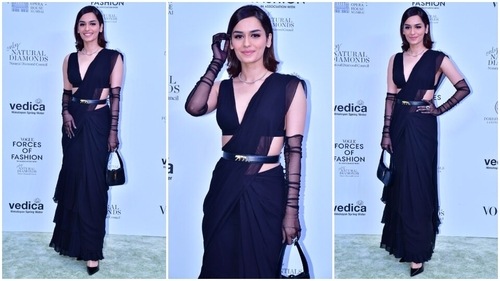 Manushi Chhillar looks stunning in a black chiffon belted saree. (HT Photo/Varinder Chawla) Manushi Chhillar looks stunning in a black chiffon belted saree. (HT Photo/Varinder Chawla)