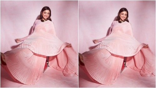 Parineeti's ombre blush pink saree features intricate pleats on the pallu, pleats and border. The additional ruffled details on the pallu and the border added a retro feel to the look. (Instagram/@parineetichopra) Parineeti's ombre blush pink saree features intricate pleats on the pallu, pleats and border. The additional ruffled details on the pallu and the border added a retro feel to the look. (Instagram/@parineetichopra)