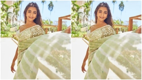 Pooja’s pastel green saree came decorated at the borders in white threads and silver mirror work is absolutely gorgerous (Instagram/@hegdepooja)