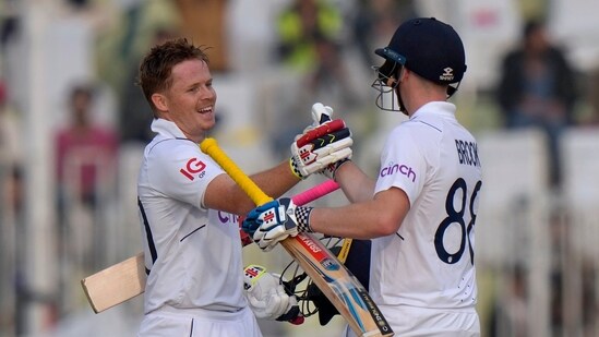 England's Ollie Pope, left, celebrates with teammate Harry Brook after scoring century during the first day(AP)