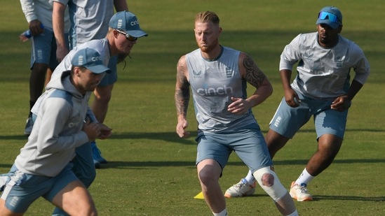 England's captain Ben Stokes (2R) warms up along with teammates during a training session ahead of their first cricket Test match against Pakistan, at the Rawalpindi Cricket Stadium in Rawalpindi on November 28, 2022. (Photo by Aamir QURESHI / AFP)(AFP)