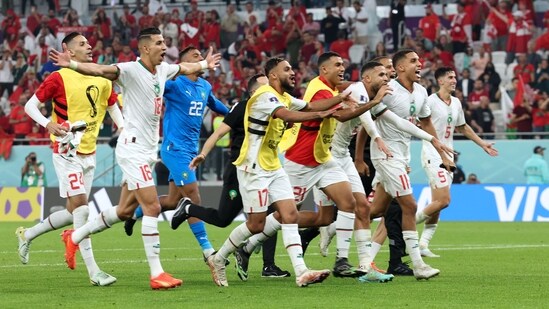 Morocco's players celebrate winning the FIFA World Cup Group F match against Canada(AFP)
