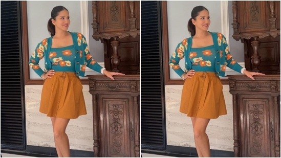 Sunny Leone’s floral prime, quick skirt is ideal for a summer season getaway 4 Sunny decked up in a blue top with a square neckline and floral patterns in shades of white and orange. She further added a cropped shrug featuring same print and full sleeves to her look.(Instagram/@sunnyleone)