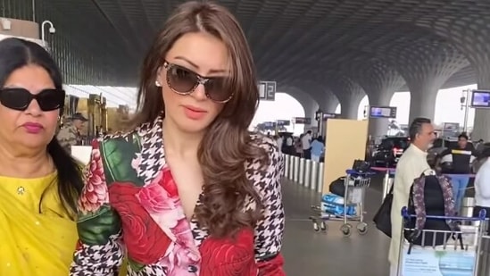 At the Mumbai airport, Hansika wore a printed floral outfit along with black boots. She also carried a black handbag to finish her travel look. She also sported sunglasses. (Varinder Chawla)((Varinder Chawla))