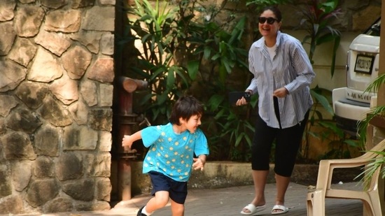 Kareena Kapoor Khan was spotted in Bandra with her eldest son, Taimur Ali Khan. After getting down from their car, Kareena was chasing Taimur who appeared to be running away from her. The mother-son duo sported casual looks. (Varinder Chawla)((Varinder Chawla))
