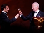President Joe Biden and French President Emmanuel Macron toast during a State Dinner. President Joe Biden and French President Emmanuel Macron toast during a State Dinner.
