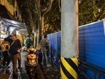 Covid Protests In China: Barricades erected along Wulumuqi Road, a site of earlier protests, in Shanghai, China.(Bloomberg) Covid Protests In China: Barricades erected along Wulumuqi Road, a site of earlier protests, in Shanghai, China.(Bloomberg)
