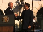 The image  shows US President Joe Biden's ‘awkward’ 42-second handshake with France President Emmanuel Macron.