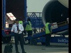 Screengrab from viral video: Indigo ground staff seen manhandling and tossing luggage from the aircraft to the trailer. Screengrab from viral video: Indigo ground staff seen manhandling and tossing luggage from the aircraft to the trailer.