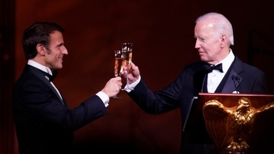 President Joe Biden and French President Emmanuel Macron toast during a State Dinner. (AP) President Joe Biden and French President Emmanuel Macron toast during a State Dinner. (AP)
