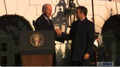 The image  shows US President Joe Biden's ‘awkward’ 42-second handshake with France President Emmanuel Macron. (Screengrab)
