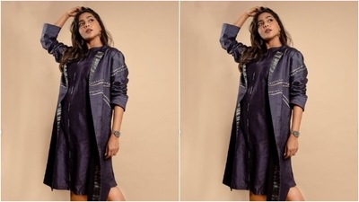 Here’s a picture of a sassy Aishwarya rocking the look in a dark blue satin short dress and layered with a blue satin shrug. (Instagram/@aishu__)