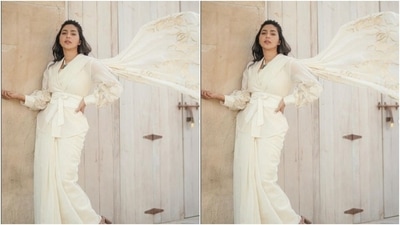 Aishwarya looked like a million bucks in the sheer white saree featuring golden details at the pallu, paired with a white blazer with puffy full sleeves. (Instagram/@aishu__)