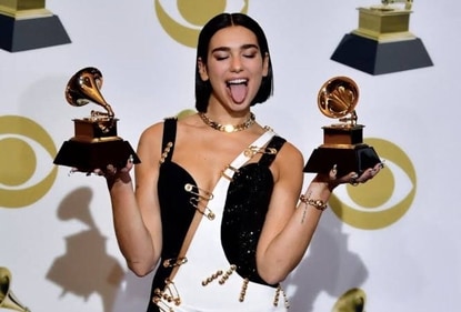 Dua Lipa is dressed to perform at the event in a striking black and white gown with cutaways and safety pin embellishments. (Instagram) Dua Lipa is dressed to perform at the event in a striking black and white gown with cutaways and safety pin embellishments. (Instagram)