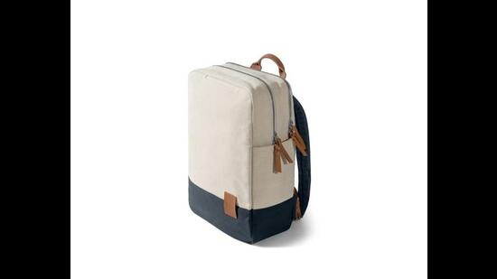 This spacious, box shaped, muti compartment and functional backpack will fit just about everything you need. (The Ivory & Navy 9 to 9 backpack by Daily Objects)