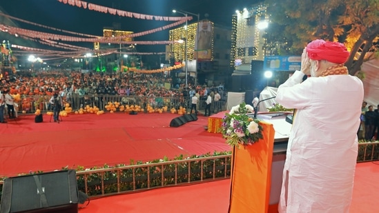 Gujarat Assembly election 2022: Union Home Minister Amit Shah greets supporters during a public meeting in Ahmedabad. (Twitter/Amit Shah via ANI) Gujarat Assembly election 2022: Union Home Minister Amit Shah greets supporters during a public meeting in Ahmedabad. (Twitter/Amit Shah via ANI)