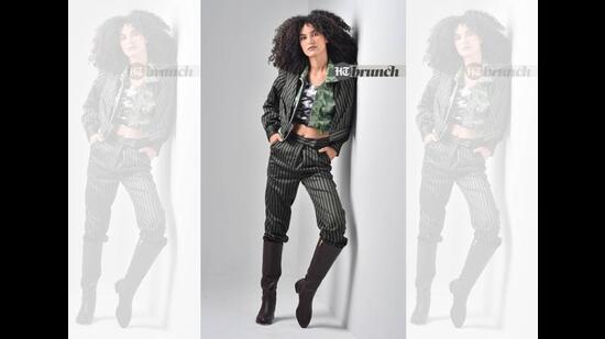 The Bengal plaid business suit looks great with a black or white sports bra or turtleneck crop top;  Mellow Drama pants and jacket;  Kappa's Bralette;  All To Defy Boots Micro Jacket by Rosso Brunello (Raj K Raj)