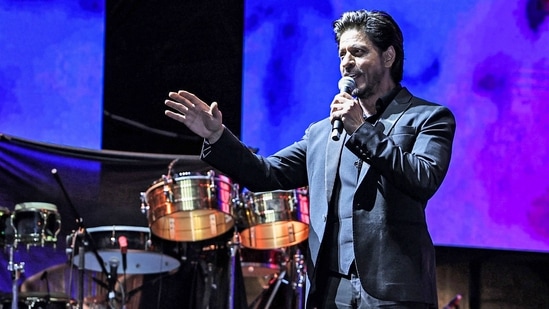 A handout picture released by the Red Sea International Film Festival (RSFF) shows Shah Rukh Khan addressing fans at the corniche in Saudi Arabia's Red Sea coastal city of Jeddah on December 1, 2022. (AFP)(AFP)