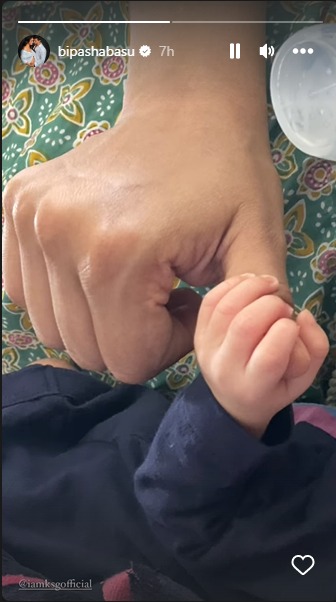 Bipasha posted a zoomed-in photo in which Devi held her thumb.