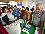 Polling officers at a training center on Saturday. (Sanchit Khanna/HT photo) Polling officers at a training center on Saturday. (Sanchit Khanna/HT photo)