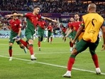 Portugal's Cristiano Ronaldo celebrates scoring their first goal with Joao Felix and Bernardo Silva.