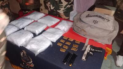 The heroin, arms and ammunition seized by the Border Security Force after a drone from Pakistan dropped it along the border in Fazilka early on Saturday. (HT Photo) The heroin, arms and ammunition seized by the Border Security Force after a drone from Pakistan dropped it along the border in Fazilka early on Saturday. (HT Photo)