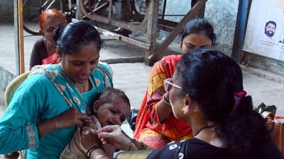 Mumbai, Dec 03 (ANI): A healthcare worker administers a vaccine to a child at a temporary vaccination camp following a measles outbreak, at Dharavi, in Mumbai on Saturday. (ANI Photo) (Vijay Shankar Bate) Mumbai, Dec 03 (ANI): A healthcare worker administers a vaccine to a child at a temporary vaccination camp following a measles outbreak, at Dharavi, in Mumbai on Saturday. (ANI Photo) (Vijay Shankar Bate)