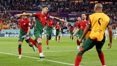 Portugal's Cristiano Ronaldo celebrates scoring their first goal with Joao Felix and Bernardo Silva. (REUTERS)