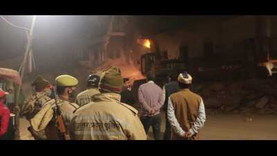 A demolition drive underway to widen roads in Ayodhya on Saturday. (HT Photo)