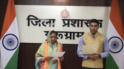 Gurugram, India-December 03: Nishant Kumar Yadav DC administering the oath newly elected Zilla Parishad member of ward 7 Anju Rani during the Swearing-in Ceremony, in Mini Secretariat, in Gurugram, India, on Saturday, 03 December 2022. (Photo by Parveen Kumar/Hindustan Times)