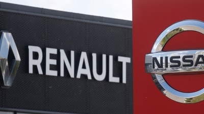 The logos of car manufacturers Nissan and Renault are pictured at a dealership. (Reuters)