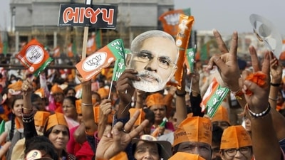 BJP supporters during a rally in Gandhinagar during the Gujarat elections. (PTI) BJP supporters during a rally in Gandhinagar during the Gujarat elections. (PTI)