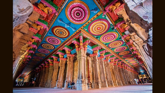 Murals have long adorned the insides of the Meenakshi temple in Madurai. But interior and exterior surfaces are increasingly being given bright coats of enamel paint, risking damage to the stones beneath. (Shutterstock)