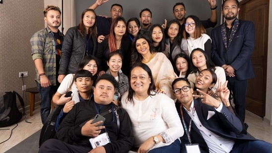 Sushmita Sen posed with the crew of the festival in Manipuri traditional attire. She captioned one of her posts, "#yourstruly Adorning Manipur’s traditional handwoven woollen shawl & their gorgeous headgear #kajenglei #beautiful #royal #celebration."(Instagram/@robertnaoremstudio)