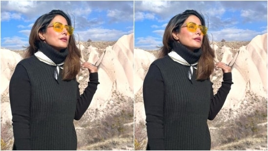 हिना एक काले फुल-स्लीव्स स्वेटर में नजर आईं, जिसमें टर्टल नेक डिटेल्स और कमर के नीचे कट डिटेल्स थीं। (Instagram/@realhinakhan)