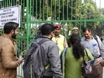 New Delhi, Dec 03 (ANI): Polling officials interact with police officials outside a polling booth on the eve of Municipal Corporation of Delhi (MCD) elections on Saturday. (ANI Photo/ Amit Sharma) New Delhi, Dec 03 (ANI): Polling officials interact with police officials outside a polling booth on the eve of Municipal Corporation of Delhi (MCD) elections on Saturday. (ANI Photo/ Amit Sharma)