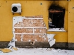 This photograph taken on December 3 shows a cut off of the wall of a damaged building from where a group people tried to steal a work of the famous British artist Banksy in the town of Gostomel, near Kyiv, amid the Russian invasion of Ukraine.