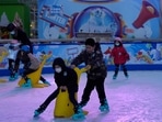 Children play at a mall with shops re-opening for business as restrictions are eased in Beijing. Chinese authorities announced a further easing of Covid-19 curbs with major cities such as Shenzhen and Beijing no longer requiring negative tests to take public transport. (AP Photo/Ng Han Guan) Children play at a mall with shops re-opening for business as restrictions are eased in Beijing. Chinese authorities announced a further easing of Covid-19 curbs with major cities such as Shenzhen and Beijing no longer requiring negative tests to take public transport. (AP Photo/Ng Han Guan)